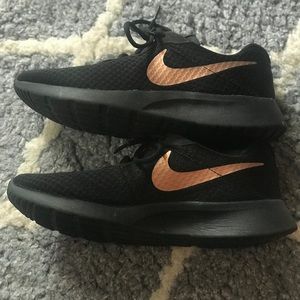 Nike black and rose gold running shoes, size 8.5